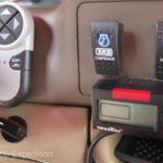 To the right of the steering wheel, there is a remote hand controller for our roof-mounted GoLight, the information screen for our SmarTire pressure/temp tire monitoring system, switches to engage our front differential ARB locker and to turn on our dual ExtremeAire 12-volt compressors, and a switch to toggle between front, rear or in-camper Total Vision cameras.