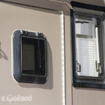 We installed a small window to be able to peek out the door without opening it.